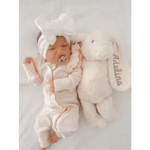 FLUTTER RUFFLE RIBBED ONESIE | SOFT PEACH