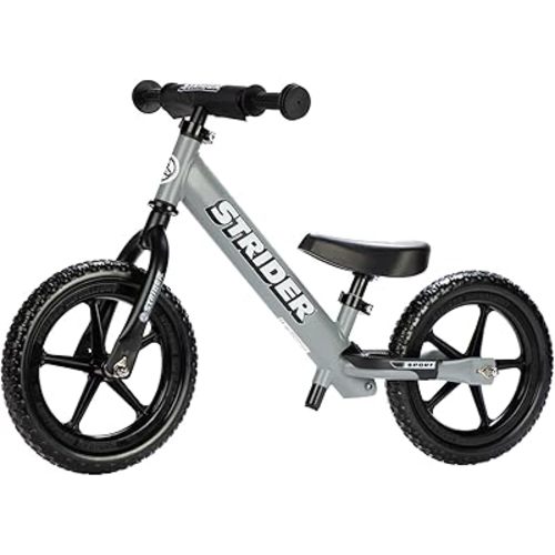 Strider 12” Sport Bike - No Pedal Balance Bicycle for Kids 1 to 4 Years - Includes Safety Pad, Padded Seat, Mini Grips & Flat-Free Tires - Tool-Free Assembly & Adjustments