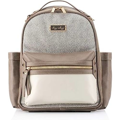 Itzy Ritzy Backpack – Chic Mini Diaper Bag with Vegan Leather Changing Pad, 8 Total Pockets (4 Internal and 4 External), Grab-Top Handle and Rubber Feet, Vanilla Latte