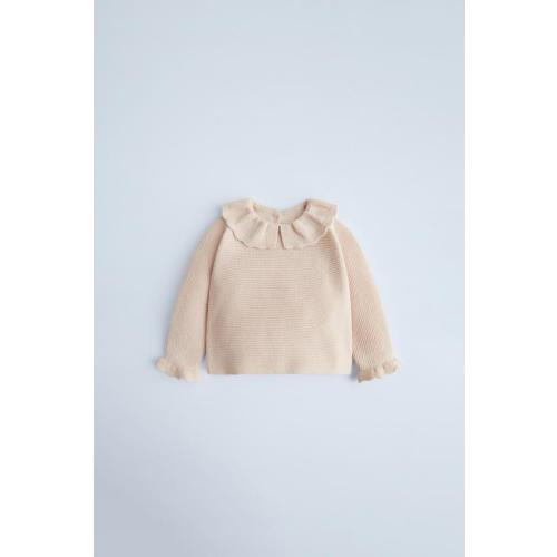 SEED STITCH KNIT BONNETRUFFLED KNIT SWEATERKNIT FOOTED LEGGINGS WITH BOW