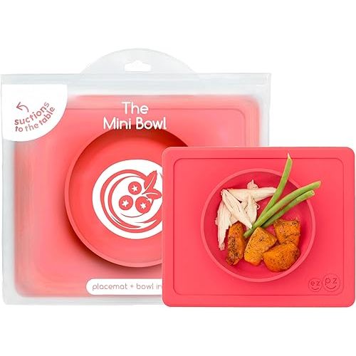 ezpz Mini Bowl for 12 Months+ (Coral) - 100% Silicone Suction Bowl with Built-in Placemat for Toddlers - Comes with a Reusable Travel Bag