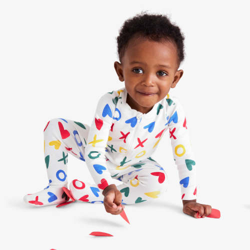 Organic zip footie in rainbow XOs | Primary.com
