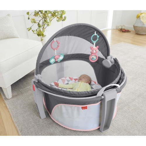 Fisher-Price Bassinet On-The-Go Infant Dome Portable Bassinet and Play Space with Toys, Rosy Windmill, Unisex