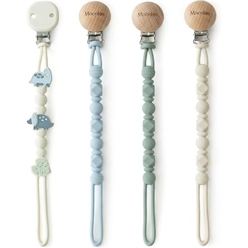 Moonkie Silicone Pacifier Clips for Baby – Durable One-Piece Binky Holder, Mixed Styles Paci Clips, Baby Essentials for Newborn Boys & Girls - 4 Pack (Dino Roars)