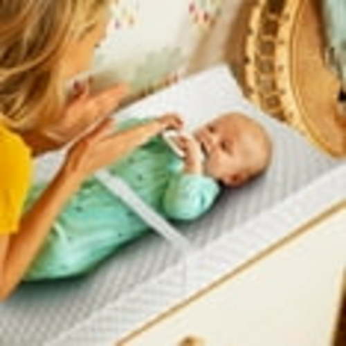 Munchkin® Secure Grip™ Contoured Waterproof Baby Diaper Changing Pad, Includes Cover, White