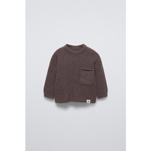 Sweater with round neck and long sleeves with cuffs. Back button closure. Patch pocket at chest. Label appliqué at hem. - Dark brown | ZARA United States