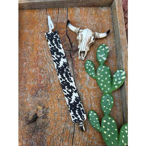 Black and white cowprint baby pacifier clip