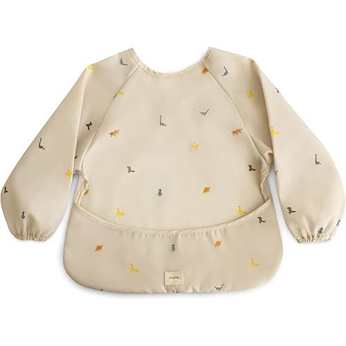 mushie Long Sleeve Baby Bib | Mess Free & Waterproof Fabric for Toddlers | Adjustable Fit for Ages 6-24 Months (DINOS)