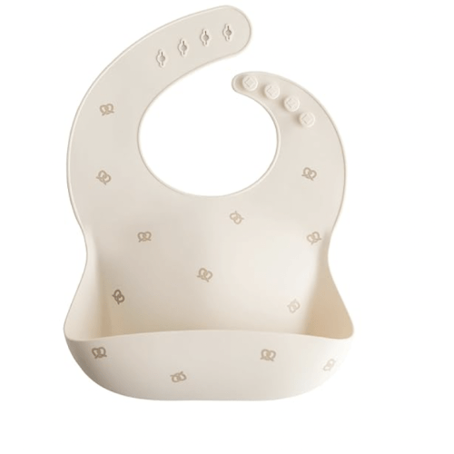 mushie Silicone Baby Bib | Adjustable Fit Waterproof Bibs (Pretzel)