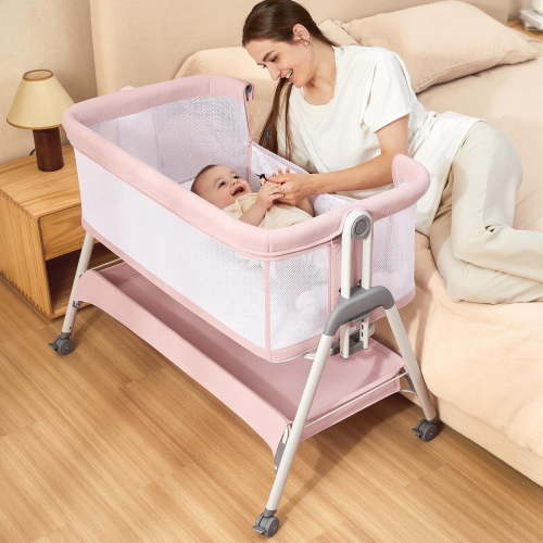 ANGELBLISS Flat Bedside Bassinet with Storage Basket, Easy Folding Portable Crib with Wheels, Included Breathable Mesh, Cozy Mattress(Pale Pink)(0-6 months)