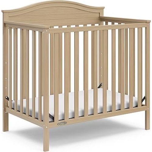 Graco Stella 4-in-1 Convertible Mini Crib with Bonus Mattress (Driftwood) – Includes Bonus 2.50 Inch Thick Mattress with Water-Resistant Cover, Converts to Twin Bed with Headboard and Footboard