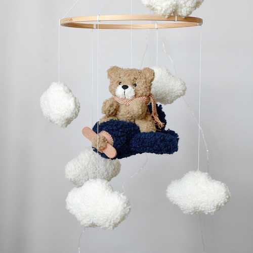 Mobile Teddy Bear from Boucle on an Airplane Boucle Clouds, Airplane Neutral Gender Mobile Children&#39;s Decor boucle Mobile Clouds Brown Bear