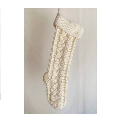Homemade cream colored Christmas stocking.