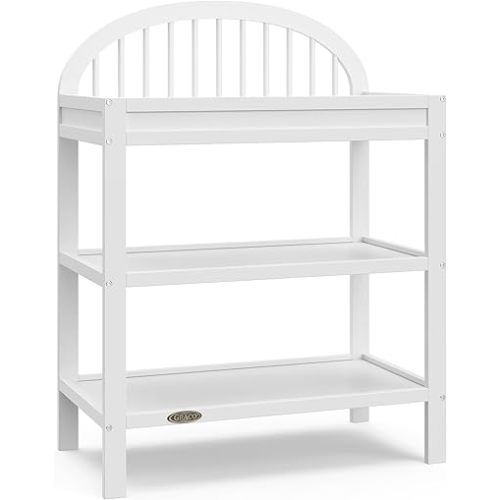 Graco Olivia Changing Table with Water-Resistant Changing Pad (White) - GREENGUARD Gold Certified, Includes Bonus Water-Resistant Changing Pad with Safety Strap, 2 Open Shelves, Stylish Design