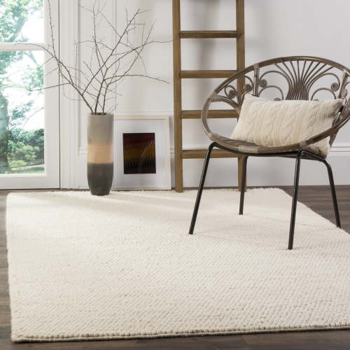 SAFAVIEH Naturals: Feride Solid Braided Wool Area Rug for Living Room, Large 8'x10', Ivory