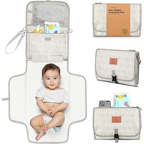 KeaBabies Portable Diaper Changing Pad - Large Waterproof Baby Changing Mat, Compact Travel Diaper Clutch, Functional Pockets Fit Newborn Essentials, Wipeable & Padded Baby Changer (Prism)