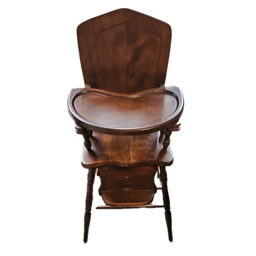 Vintage high chair made of beautiful wood. Built Between WW Eras.