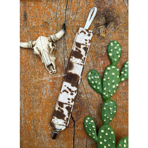 Brown and white cowprint baby pacifier clip