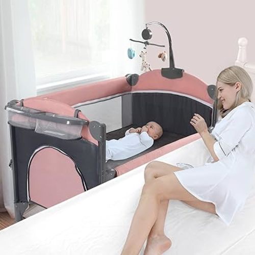 Jaoul 5 in 1 Baby Crib, Bassinet Beside Sleeper, Pack and Play with Bassinet and Changing Table Portable Travel Playpen with Toys & Music Box, Mattress for Girl Boy Infant Newborn Pink