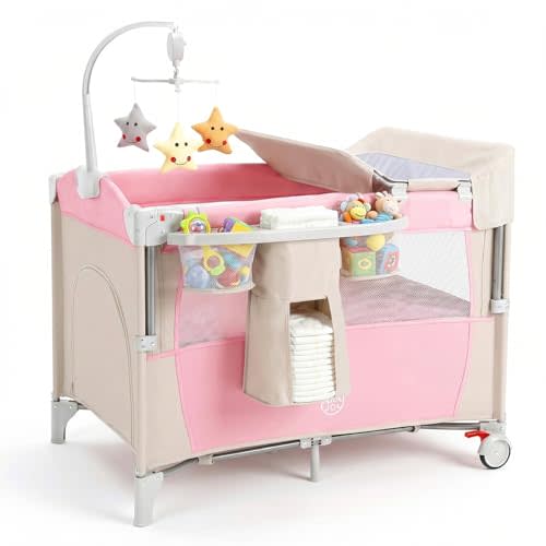 BABY JOY 5-in-1 Pink Pack and Play, Portable Baby Bedside Sleeper with Bassinet, U-Shaped Diaper Changer, Safety Strap, Side Zipper Entrance, Hangings, Bedside Crib Playard from Newborn to Toddlers