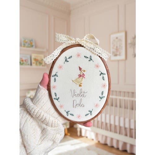 Baby name sign embroidered with storybook goose and florals, newborn birth announcement plaque, oval nursery wall hanging, gift for new mum