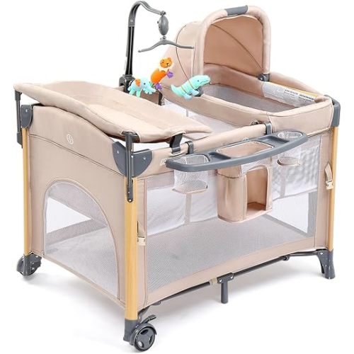 JOYMOR 7 in 1 Bedside Bassinet with Changing Table, All in One Nursery Center, Bedside Sleeper with Mattress, Sheet, Canopy, Storage Shelf and Hanging Toy (Beige)
