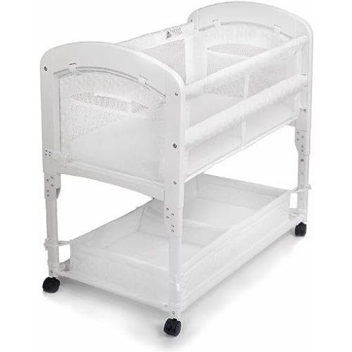 Arm’s Reach Cambria Co-Sleeper Bedside Bassinet Featuring Height-Adjustable Legs, Curved Wooden Ends, Breathable Mesh Sides with Pockets, and Large Lower Storage Basket, White
