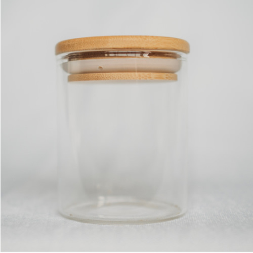 Small glass storage jar with bamboo lid