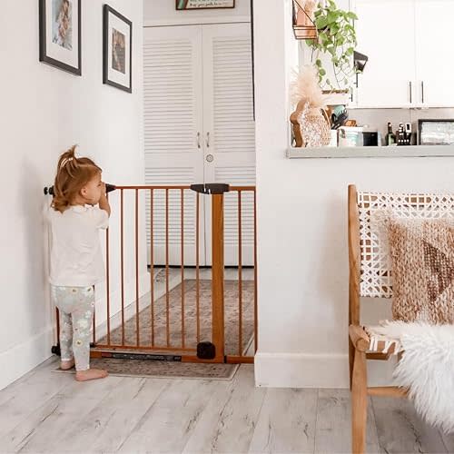Toddleroo by North States Woodcraft Steel Baby Gate: Self-Closing Child Gate with Hold-Open Feature. Pressure Mounted Baby Gate with Door, Fits Openings 29.75” to 40.5” Wide. (30" Tall, Brown)