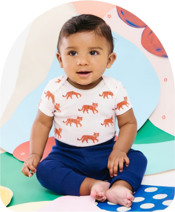 baby in small story clothing