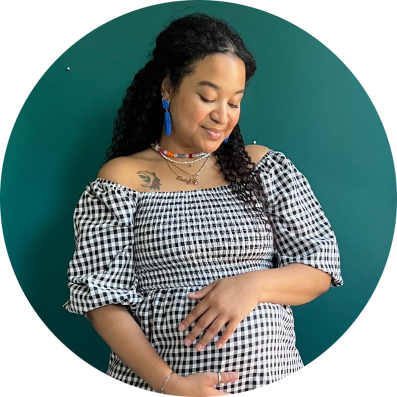 pregnant person cradling bump