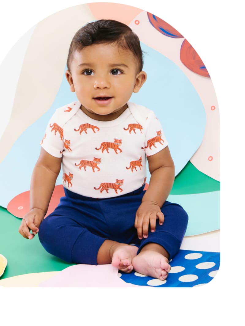 baby in small story clothing