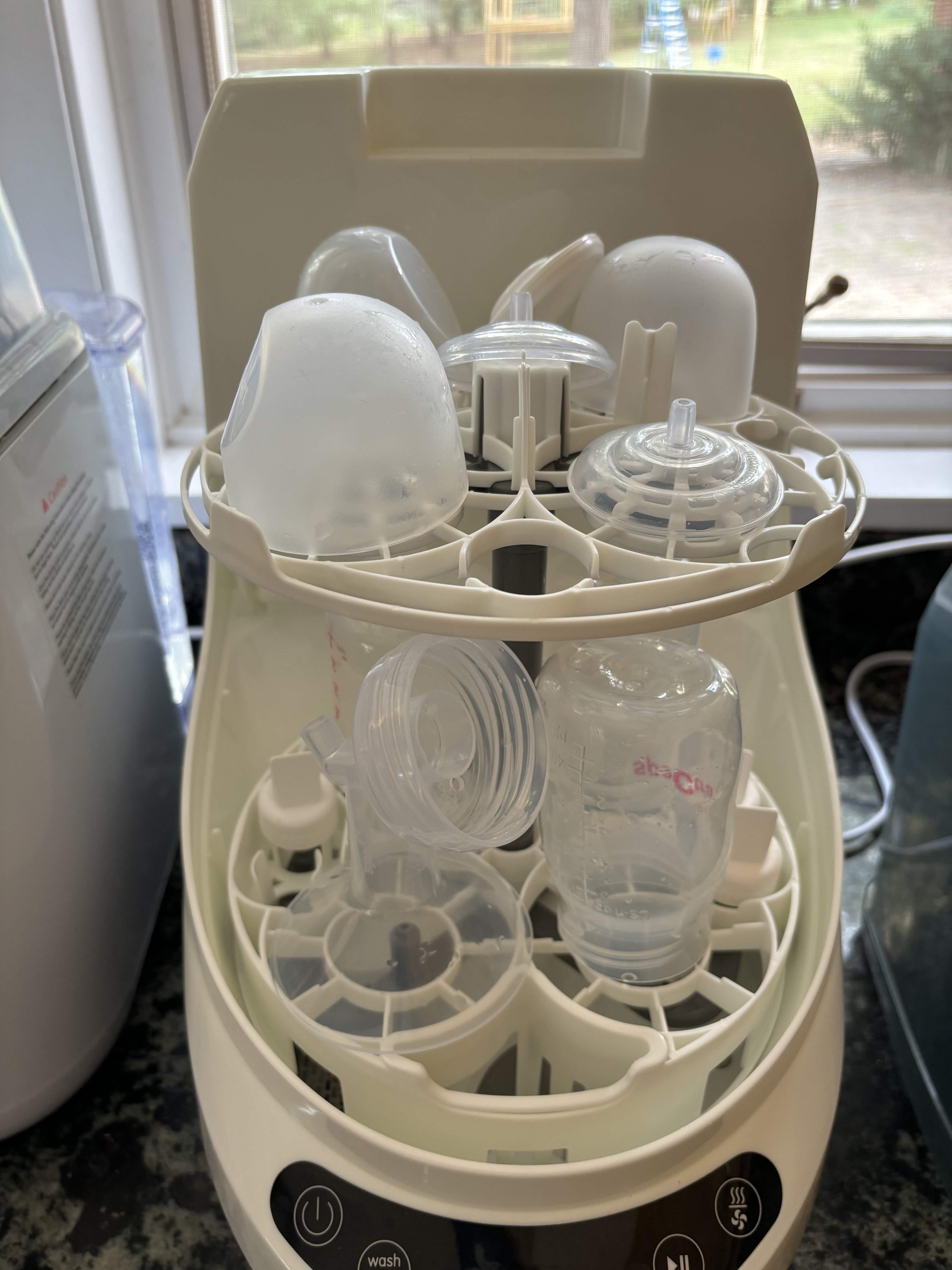 Baby bottle parts in Baby Brezza Bottle Washer.