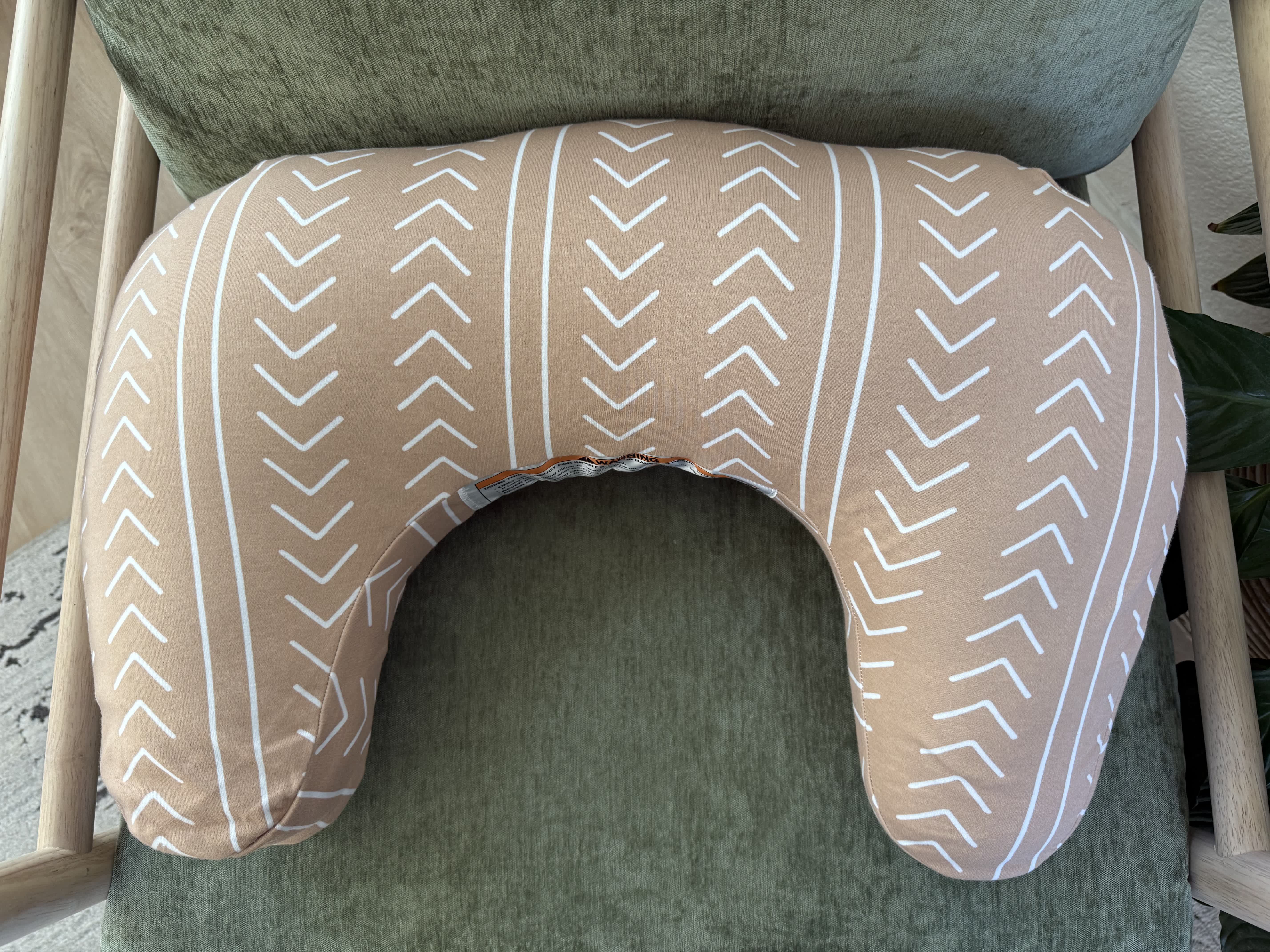 Front view of Boppy nursing pillow on a chair.