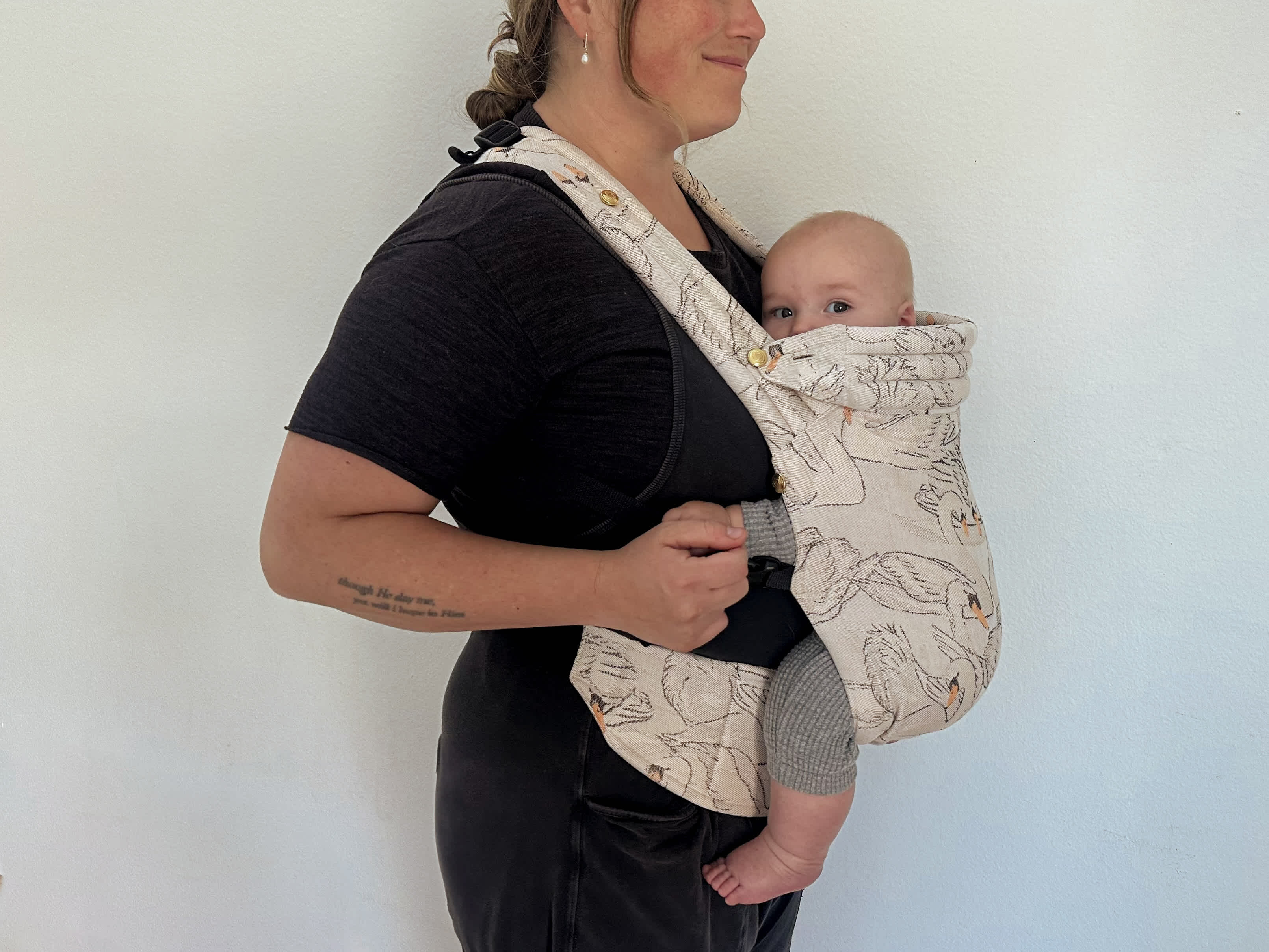 Parent carrying baby in the Zeitgeist.