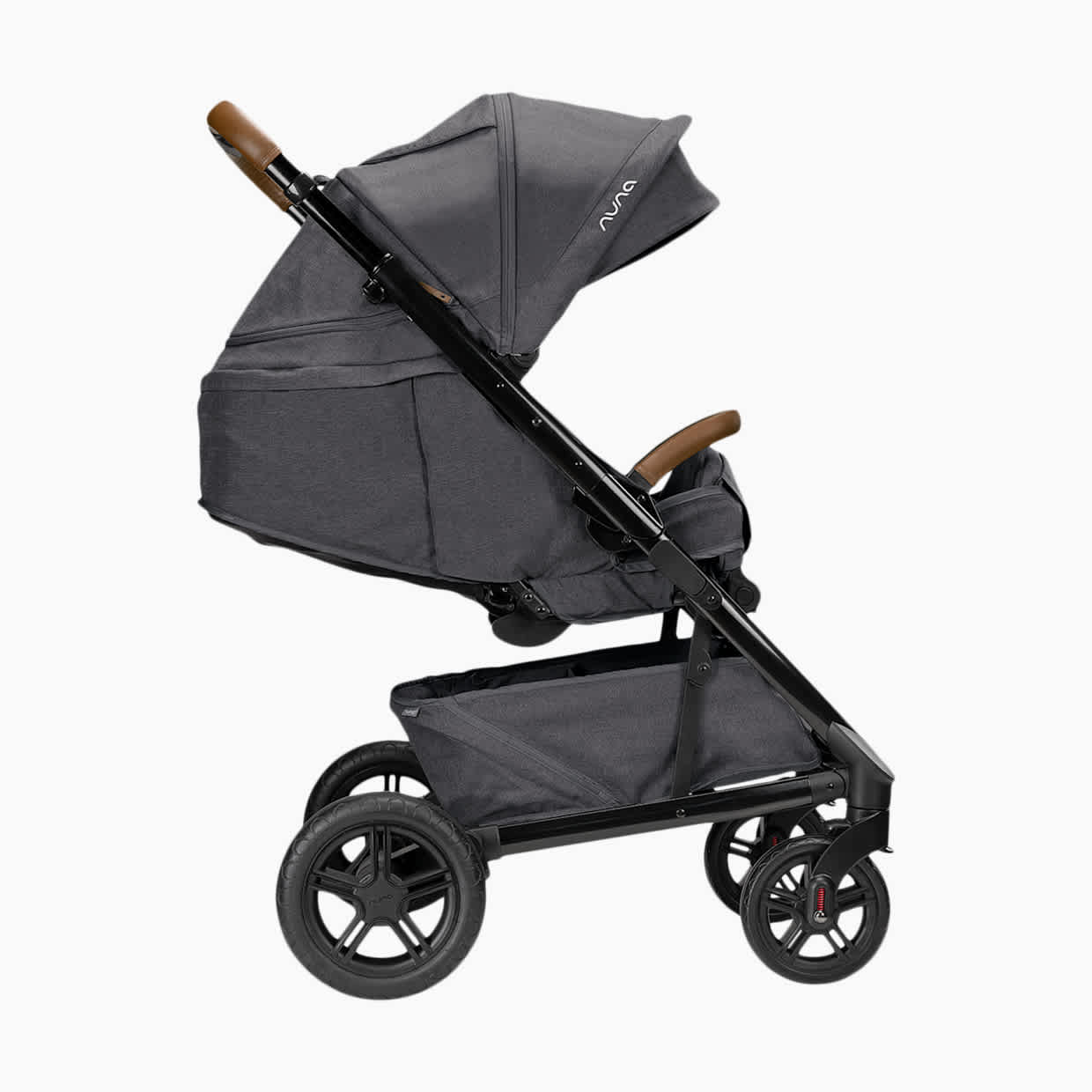 A side view of a gray Nuna Tavo Next stroller with the seat reclined nearly flat.