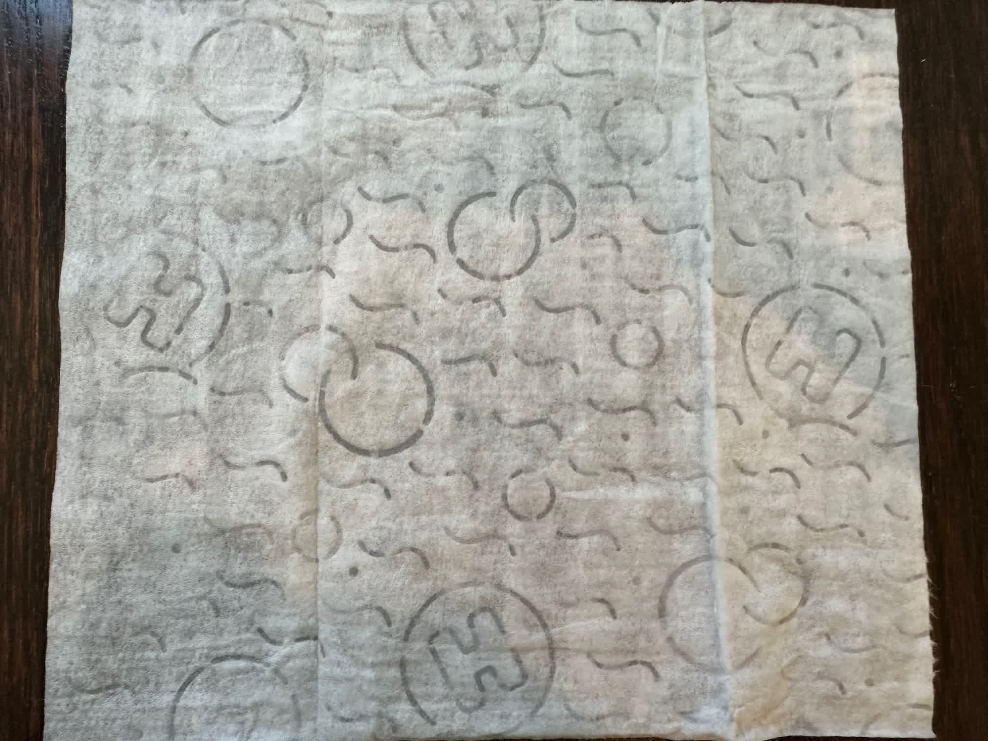 A close-up view of the texture pattern on Huggies Natural Care wipes.