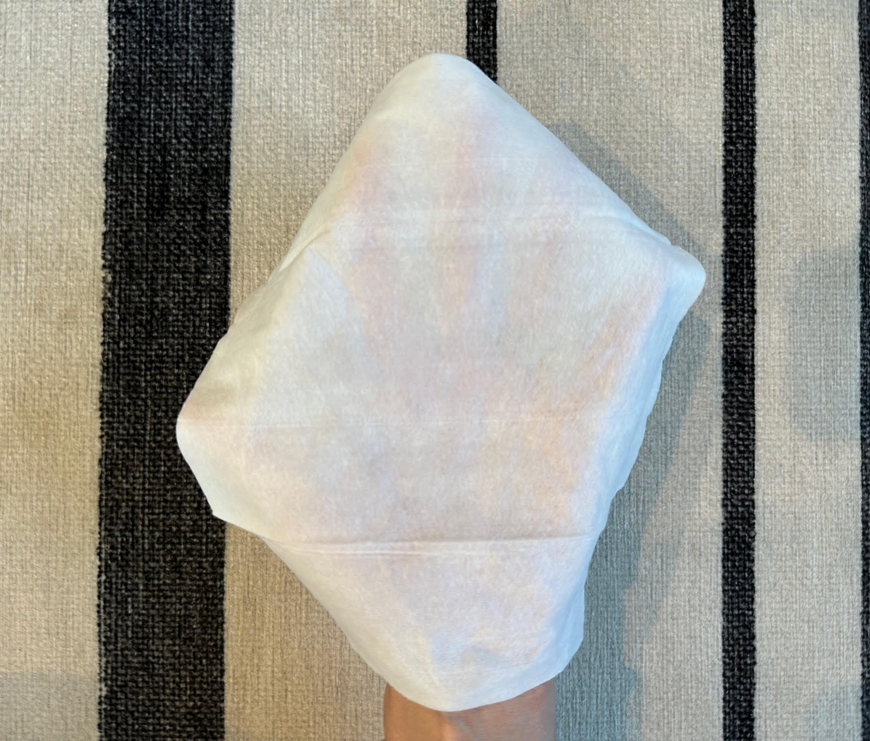 Coterie makes the thickest wipe that I tested. You can hardly see my hand beneath it.