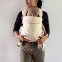Parent wearing baby in the Wildbird Aerial Carrier thumbnail.