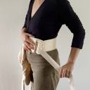 Parent putting on the WildBird Aerial carrier belt loop thumbnail.