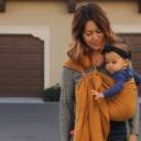 Parent and baby using a ring sling thumbnail.