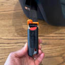 The flexible LATCH connectors on the base of the UPPAbaby Aria Infant Car Seat. thumbnail.