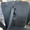 A convertible car seat top tether connected to the top tether anchor in the second row of a 2021 Jeep Grand Cherokee L. thumbnail.