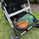 The oversized storage basket on the Mockingbird Single Stroller easily holds a large diaper bag and other items. thumbnail.