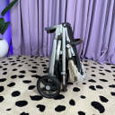 A side view of a folded UPPAbaby Vista V3 stroller. thumbnail.