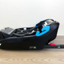 A side view of the black base of the Clek Liing Infant Car Seat with the rigid LATCH connectors extended. thumbnail.