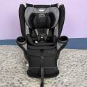 A head shot of a black Evenflo Revolve360 Extend car seat with the extension panel in use thumbnail.