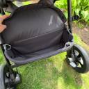 The Joie Hazel has a large storage basket, including a covered storage pouch. thumbnail.