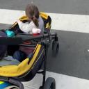 Evenflo Pivot Xplore All-Terrain Stroller Wagon on Street Terrain thumbnail.