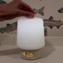 A woman's hand turning on the Hatch Baby, adjusting the volume up and down and turning the unit off. thumbnail.